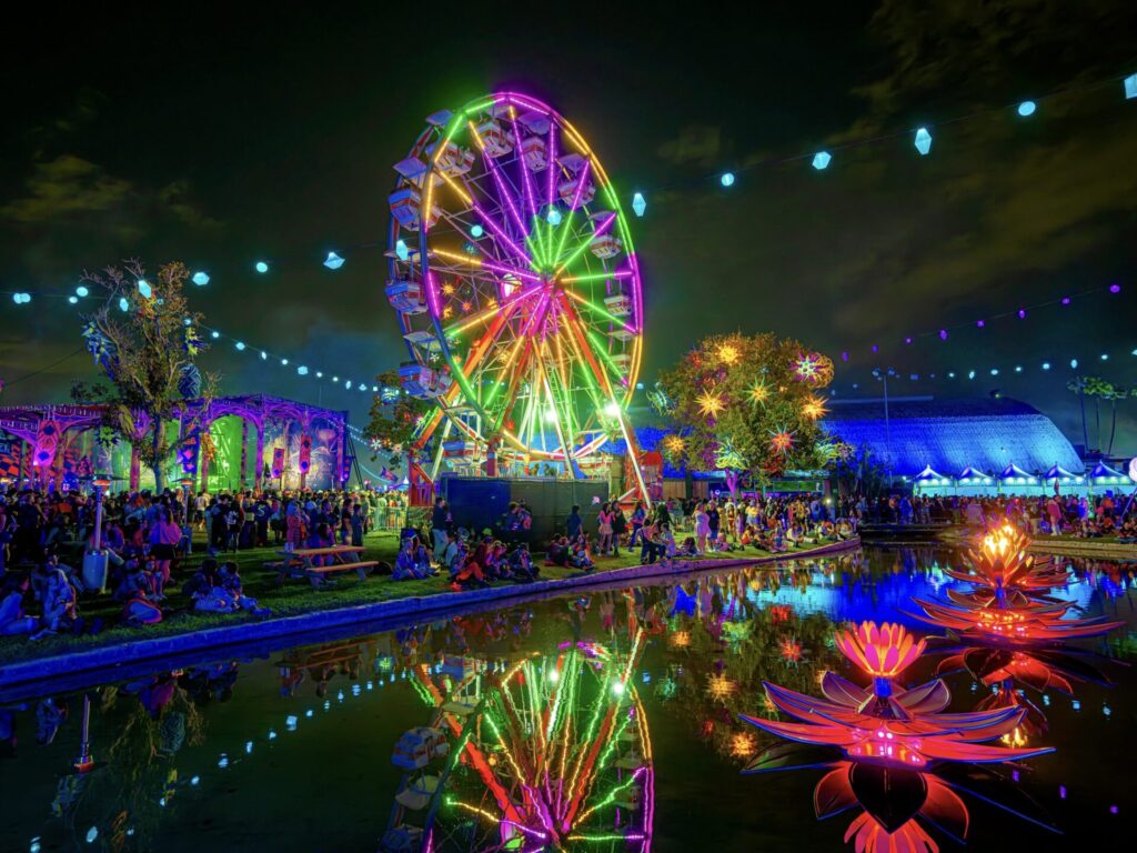 A picture of the ferris wheel and pond at Beyond Wonderland SoCal